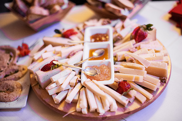 Enjoying a delightful cheese platter with various flavors and ac