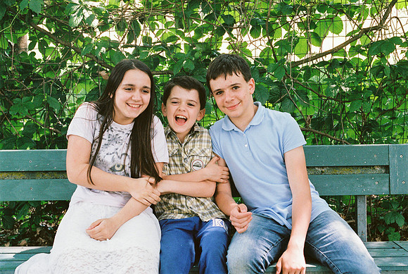 portrait of brothers children sitting on a bench two brothers an