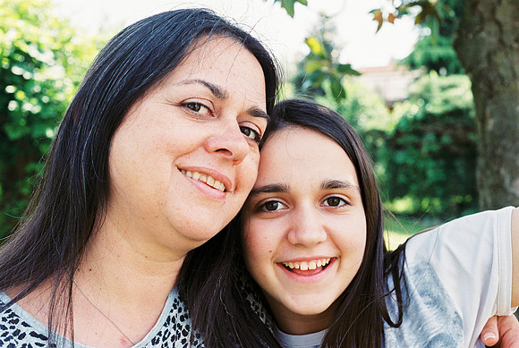 portrait of mother with her teenage daughter