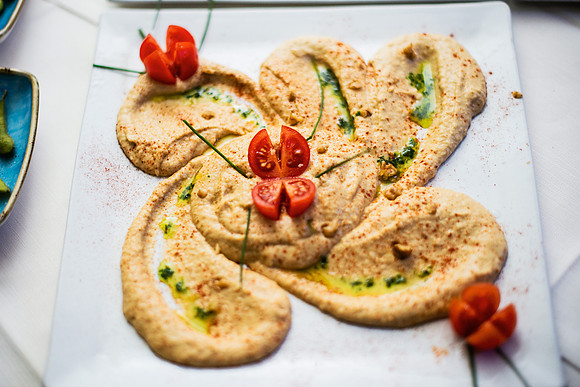 Deliciously arranged hummus dish served during a fine dining exp